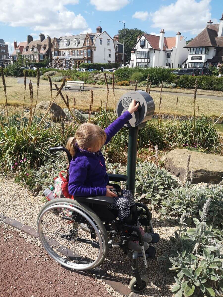 A young wheelchair user on a sensory pathway.